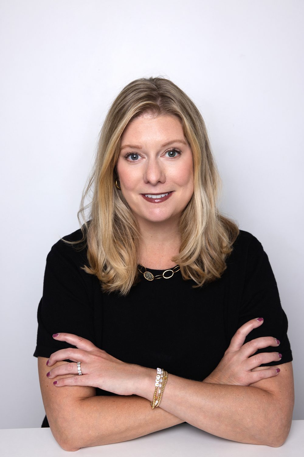 Rachelle Considine smiling with arms crossed